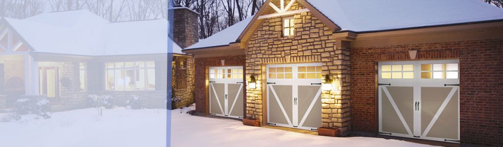 Home with garage covered with snow