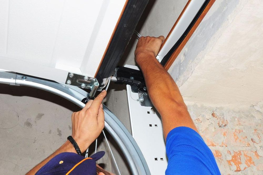Allied Door fixing the cable